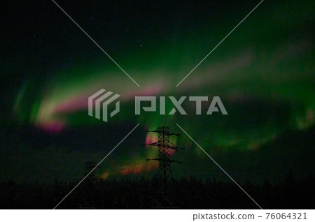 northern light on the silent field before sun rise. 76064321