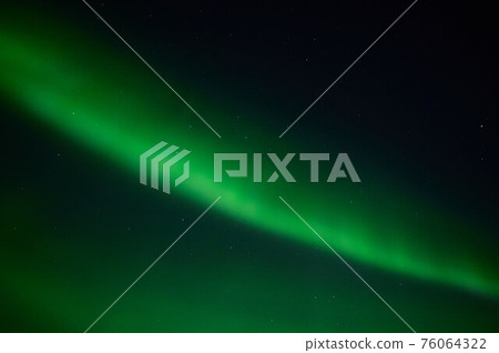 northern light on the silent field before sun rise. northern light on the silent field before sun rise. 76064322