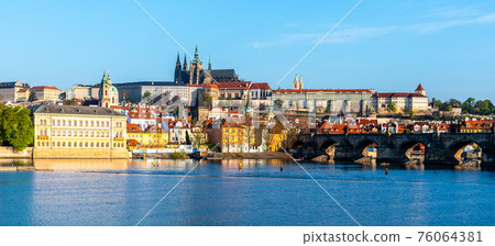 Panoramic view of Prague Castle and Charles Bridge on sunny spring morning, Praha, Czech Republic Panoramic view of Prague Castle and Charles Bridge on sunny spring morning, Praha, Czech Republic 76064381
