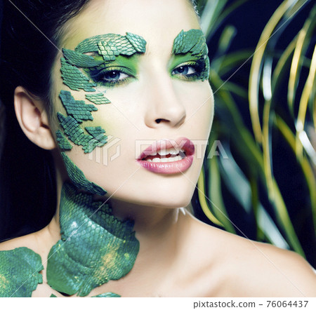 woman with creative make up like snake and rat in her hands, halloween horror closeup joke scary 76064437