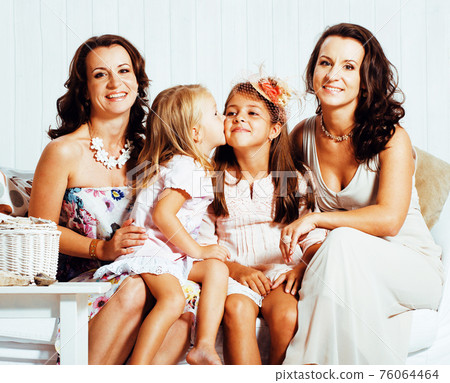 young pretty modern family at home happy smiling, lifestyle people concept, mother with cute little daughter, sister twins together young pretty modern family at home happy smiling, lifestyle people concept, mother with cute little daughter, sister twins together 76064464