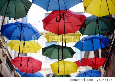 Colorful umbrellas hanging over  street of old town, Istanbul, Turkey. 76065147