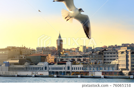 Aerial view of Beyoglu district with old houses and Galata Tower on top in Istanbul, Turkey. Aerial view of Beyoglu district with old houses and Galata Tower on top in Istanbul, Turkey. 76065158