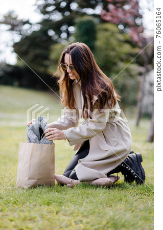happy female shopaholic getting delivery shopping bag fashion shopping happy female shopaholic getting delivery shopping bag fashion shopping 76065164