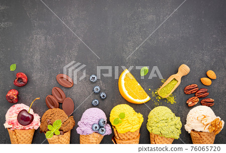 Various of ice cream flavor in cones blueberry ,green tea ,pistachio ,almond ,orange and cherry setup on dark stone background . Summer and Sweet menu concept. Various of ice cream flavor in cones blueberry ,green tea ,pistachio ,almond ,orange and cherry setup on dark stone background . Summer and Sweet menu concept. 76065720