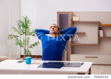 Young sick man suffering at home 76066544