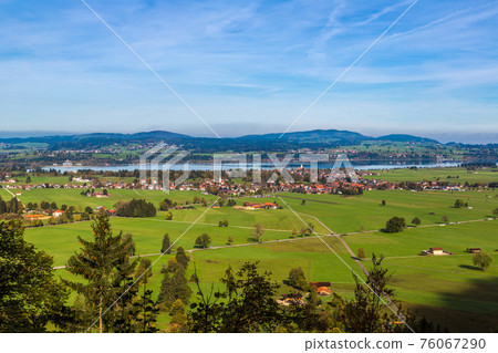 Green fields next to Neuschwanstein Green fields next to Neuschwanstein 76067290