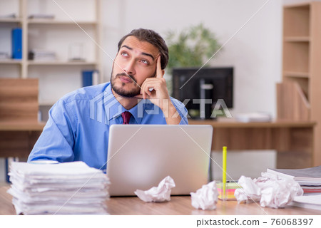 Young male employee in brainstorming concept Young male employee in brainstorming concept 76068397