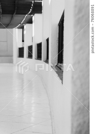 long gallery corridor with columns in perspective in black and white long gallery corridor with columns in perspective in black and white 76068891
