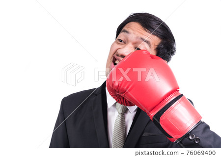 Businessman standing posture with boxing gloves Businessman standing posture with boxing gloves 76069400
