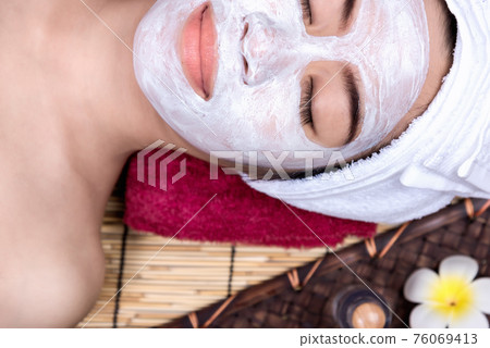 Woman in Treatment Spa Facial Mask Woman in Treatment Spa Facial Mask 76069413