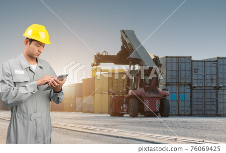 Foreman stand check tablet on front forklift loading Containers box Foreman stand check tablet on front forklift loading Containers box 76069425