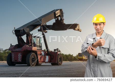 Foreman stand on front forklift loading Containers box Foreman stand on front forklift loading Containers box 76069427