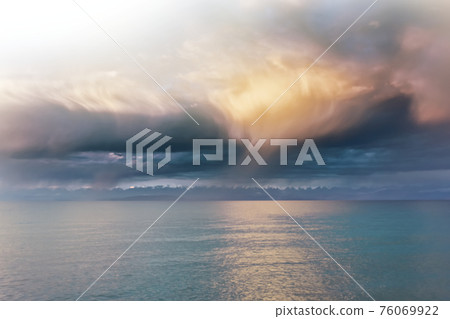 Beautiful clouds over sea. 76069922