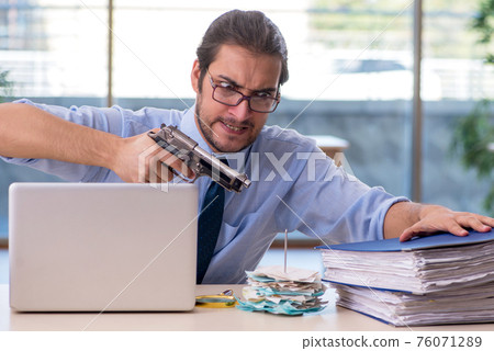 Young male accountant in bankruptcy concept Young male accountant in bankruptcy concept 76071289