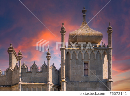 The walls and towers of the old palace on the background of beautiful pink sunset The walls and towers of the old palace on the background of beautiful pink sunset 76072141