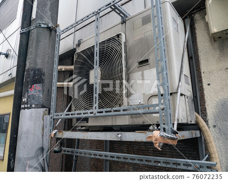 Dirty old outdoor unit equipment 76072235
