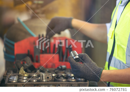 Asian engineer worker quality control of service machine in factory Asian engineer worker quality control of service machine in factory 76072781