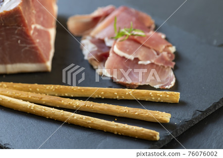 Italian ham served with grissini Italian ham served with grissini 76076002
