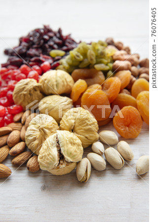 Various dried fruits and nuts 76076405