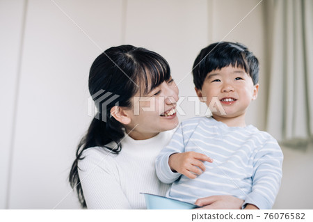 Image of mother, child-rearing, and child-rearing playing with a healthy boy 76076582