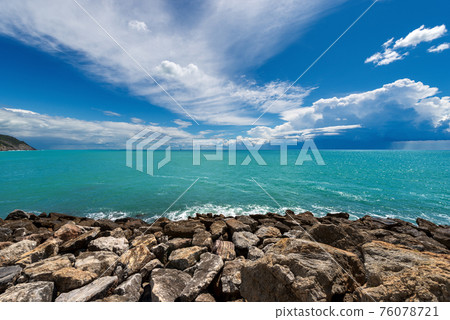 Rocky Beach and Beautiful Seascape with Storm Clouds on the Horizon - Liguria Italy 76078721