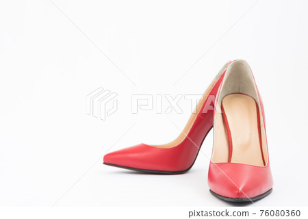 High-heeled shoes in red. Sexy shoes. White background. There is space for text 76080360