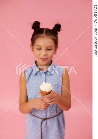 cute smiling little girl eating ice cream cute smiling little girl eating ice cream 76081721