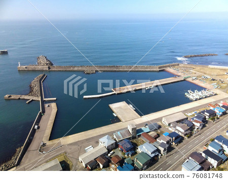 Aerial view of the scenery of Toyohama fishing port in Otobe-cho, Hokkaido in early spring 76081748