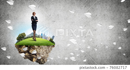Confident lady boss and modern city as concept of eco green construction Confident lady boss and modern city as concept of eco green construction 76082717
