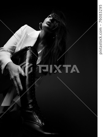 Black and white. Gorgeous tall sexy woman in white 76083295