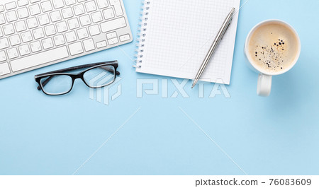 Office desk with supplies, coffee and blank notepad Office desk with supplies, coffee and blank notepad 76083609