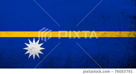 The Republic of Nauru (Pleasant Island) National flag. Grunge background 76083791