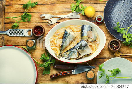 Baked or steamed fish mackerel on rustic wooden background 76084267
