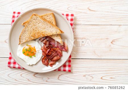 fried egg with bread toasted and bacon fried egg with bread toasted and bacon 76085262