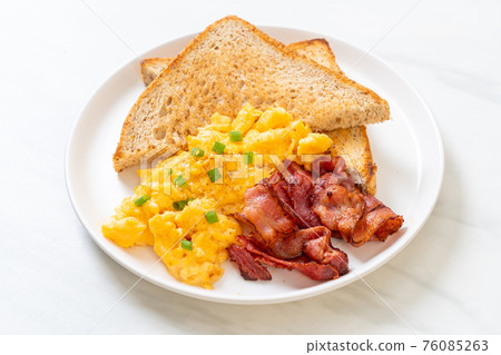 scrambled egg with bread toasted and bacon scrambled egg with bread toasted and bacon 76085263
