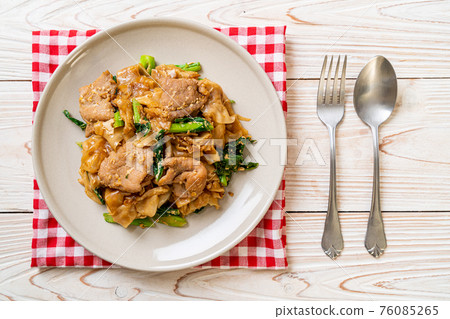 Stir-fried rice noodle with black soy sauce and pork and kale Stir-fried rice noodle with black soy sauce and pork and kale 76085265
