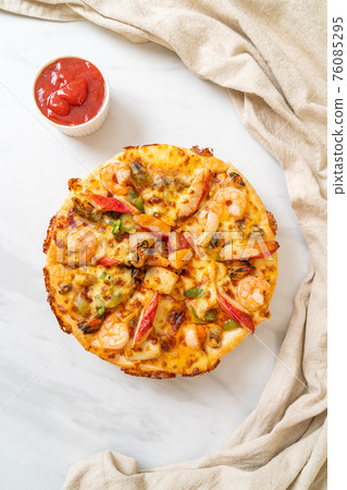 seafood pizza on wood tray 76085295