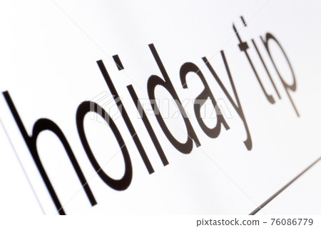 Search bar on a computer monitor with the question Holiday tip.  76086779