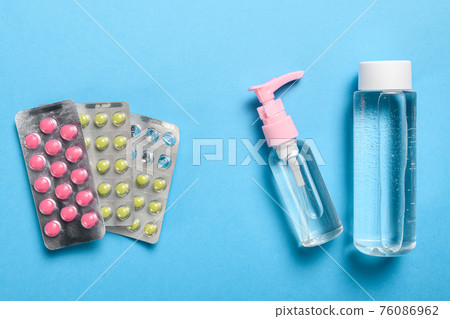 hand sanitizer and pills for medical protection against germs, covid or coronavirus hand sanitizer and pills for medical protection against germs, covid or coronavirus 76086962