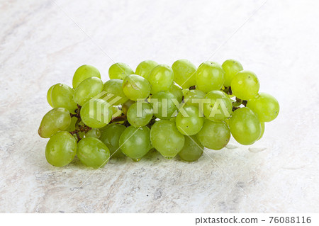 Ripe sweet green grape branch 76088116