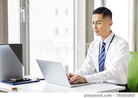 A man working on a laptop A man working on a laptop 76088860