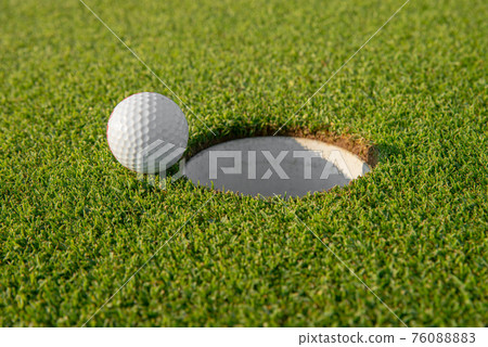golf ball on golf course 76088883