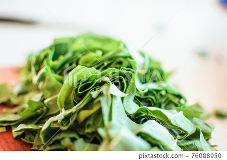 Fresh organic sorrel,plant spinach heap on wooden table for spring green vegetables soup and salad.Raw sorrel leaves top view green vegetable background.Spring green vegetables,sorrel spinach Fresh organic sorrel,plant spinach heap on wooden table for spring green vegetables soup and salad.Raw sorrel leaves top view green vegetable background.Spring green vegetables,sorrel spinach 76088950