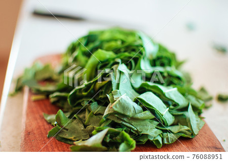 Fresh organic sorrel,plant spinach heap on wooden table for spring green vegetables soup and salad.Raw sorrel leaves top view green vegetable background.Spring green vegetables,sorrel spinach Fresh organic sorrel,plant spinach heap on wooden table for spring green vegetables soup and salad.Raw sorrel leaves top view green vegetable background.Spring green vegetables,sorrel spinach 76088951