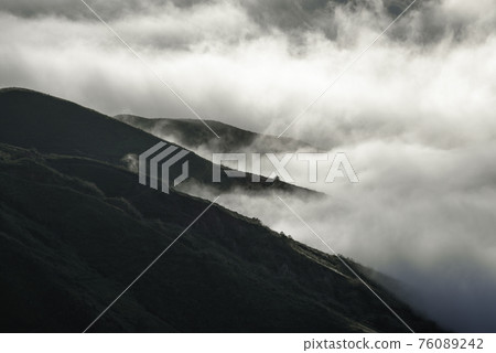 Ta Xua is a famous mountain range in northern Vietnam. All year round, the mountain rises above the clouds creating cloud inversions. Ta Xua is a famous mountain range in northern Vietnam. All year round, the mountain rises above the clouds creating cloud inversions. 76089242