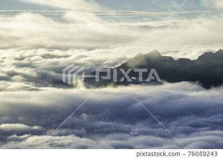 Ta Xua is a famous mountain range in northern Vietnam. All year round, the mountain rises above the clouds creating cloud inversions. 76089243
