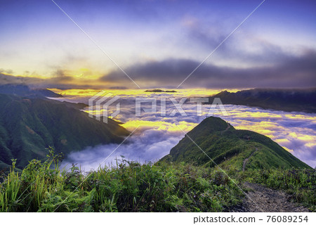 Ta Xua is a famous mountain range in northern Vietnam. All year round, the mountain rises above the clouds creating cloud inversions. Ta Xua is a famous mountain range in northern Vietnam. All year round, the mountain rises above the clouds creating cloud inversions. 76089254