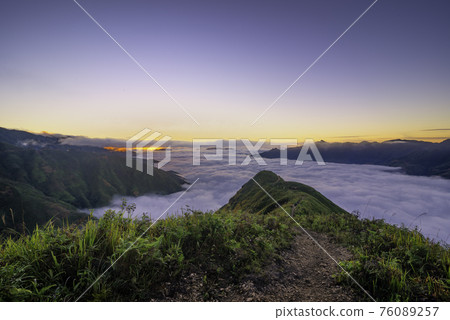 Ta Xua is a famous mountain range in northern Vietnam. All year round, the mountain rises above the clouds creating cloud inversions. Ta Xua is a famous mountain range in northern Vietnam. All year round, the mountain rises above the clouds creating cloud inversions. 76089257