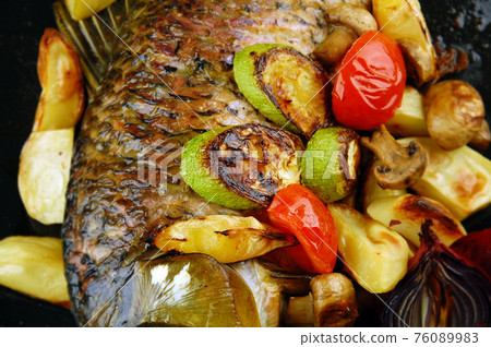 Baked fish with vegetables 76089983